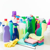 group of cleaning products and equipment on white background